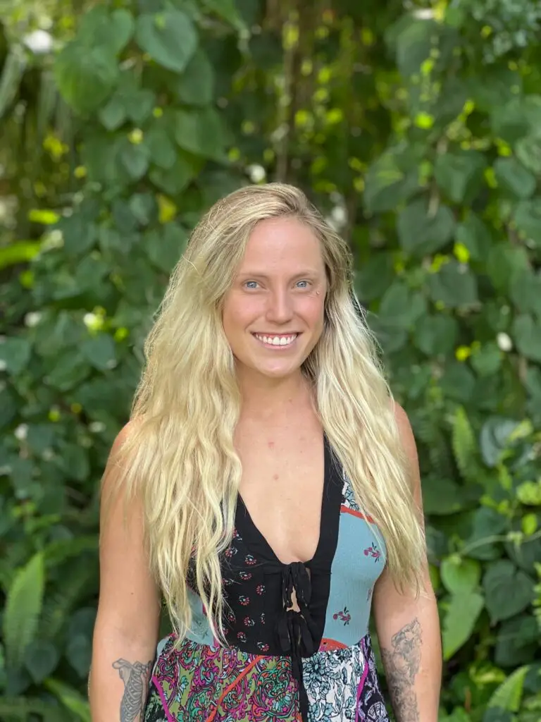Inekawa's cofounder kala hall standing in front of trees